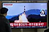 A TV screen shows a file image of a North Korean missile launch during a news program at Seoul Station in central Seoul on Wednesday. [AP/YONHAP]