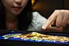 A Samsung Display employee points at the company's stretchable display screen, which has been modified to showcase the three-dimensional shape of Jeju Island. Samsung Display introduced its latest stretchable MicroLED display, which the company says has the highest resolution and elongation rate in the industry, during the 24th International Meeting on Information Display. The three-day event kicked off Wednesday in Jeju. [SAMSUNG DISPLAY]