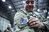 A service member of the South Korea-based United States Space Force (USSF) unit attaches the branch's badge to his right shoulder during the unit's launch ceremony at Osan Air Base in Pyeongtaek, Gyeonggi on Wednesday. [JOINT PRESS CORPS]