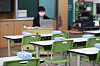 Wipes sit atop classroom desks at an elementary school in southern Seoul as teachers prepare for the reopening of classes. [YONHAP]