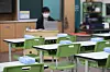 Wipes sit atop classroom desks at an elementary school in southern Seoul as teachers prepare for the reopening of classes. [YONHAP]