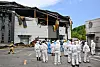 A team of firefighters and forensic workers conduct a joint investigation on Tuesday at a lithium battery plant in Hwaseong, Gyeonggi, where a fire broke out on Monday, resulting in 23 deaths. [YONHAP]