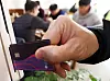 A credit card being swiped at a restaurant in Seoul in December. Despite relaxed social distancing regulation, concerns over the ongoing pandemic in November affected spending. [YONHAP]