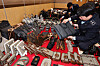 Customs officials examine counterfeit goods confiscated at the Incheon Regional Customs office in November 2023. [YONHAP]