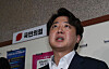 People Power Party Chairman Lee Jun-seok speaks to reporters after he was questioned by the PPP’s ethics committee at the National Assembly in western Seoul early Friday. The committee decided to suspend Lee's party membership for six months. [JOINT PRESS CORPS]