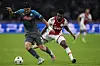 Ajax's Mohammed Kudus, right, challenges Napoli's Kim Min-jae during a Champions League match in Amsterdam on Oct. 4. [AP/YONHAP]