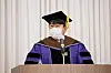 Founder of HYBE Bang Si-hyuk gives a speech during Seoul National University's conferment ceremony after receiving his honorary doctorate degree in business. [HYBE]