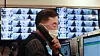 An official answers the phone while monitoring CCTVs at a community treatment center for Covid-19 patients who are asymptomatic or have mild symptoms in Yeongdeungpo District, western Seoul, Sunday. [NEWS1]