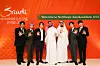Members of boy band Super Junior pose for photos with officials from the Saudi Arabia Tourism Authority on Monday. [SM ENTERTAINMENT]