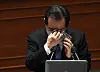 Prime Minister Chung wipes his tears after responding to a question about small business owners' crisis in the Covid-19 pandemic in Korea at a session at the National Assembly in Seoul on Friday. [YONHAP]