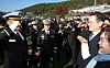 Samsung Electronics Chairman Lee Jae-yong and his mother Hong Ra-hee, right, and Lee Jee-ho, the chairman’s son, salute each other during a commissioning ceremony at the Korea Naval Academy in Changwon, South Gyeongsang, on Nov. 28. [YONHAP]