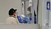 A man gets tested for Covid-19 at a testing center in Songpa District, southern Seoul, on Thursday. [YONHAP]