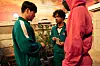 Anupam Tripathi,right, playing Abdul Ali on “Squid Game.” [NETFLIX]