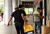 A man carries gift sets wrapped in bojagi, a Korean traditional wrapping cloth, on Sept. 13, 2024, a day ahead of the 2024 Chuseok holidays in Seo District, Gwangju. [NEWS1]