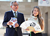 National Museum of Korea Director Yoo Hong-jun, left, and 'KPop Demon Hunters' director Maggie Kang hold presents given to each other at the museum in central Seoul on Thursday. Yoo holds a stuffed tiger named 'Derpy' from the film, and Kang holds fan drawn with tiger xylograph. The National Museum of Korea saw surge of international visitors thanks to its museum merchandises that resemble animals appearing in 'KPop Demon Hunters.' [YONHAP]