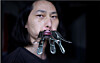 Chinese performance artist Brother Nut clamps his mouth shut on July 13 as part of a protest against censorship following the outbreak of coronavirus. [REUTERS/YONHAP]