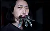 Chinese performance artist Brother Nut clamps his mouth shut on July 13 as part of a protest against censorship following the outbreak of coronavirus. [REUTERS/YONHAP]