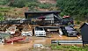 This photo, provided by authorities in northern Gyeonggi, shows holiday lodgings engulfed by a landslide in Gapyeong, Gyeonggi, on Monday. Three people were reportedly killed in the landslide. [NEWS1]