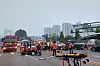 Fire authorities carry out a rescue operation at a site of a traffic accident at an intersection in Ansan, Gyeonggi, on Saturday. A van carrying day laborers collided with a bus, resulting in five deaths. [NEWS1]