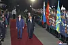 North Korean leader Kim Jong-un, right, salutes an honor guard in a welcome ceremony after crossing the border to Russia at Khasan Tuesday, where he was greeted by Russian Minister of Natural Resources and Ecology Alexander Kozlov, left, in a photo provided by the North’s Korean Central News Agency Wednesday. [YONHAP]