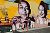 Artist Brandan “BMike” Odums, right, works with artist Whitney Alix on a mural depicting Emmett Till and his mother Mamie Till-Mobley in Los Angeles on Oct. 22. The mural is part of a collection called “Impact of Images” and was commissioned by Lead With Love, in collaboration with the studio and production company behind the film “Till.” [AP/YONHAP]