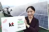 A KT employee poses for a photo in front of solar panels installed at the company's office building in Gwanak District, southern Seoul. [KT]