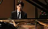 Pianist Cho Seong-jin performs during a press conference held at the Seoul Arts Center on Friday. [YONHAP]