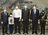 From left, President of War Memorial of Korea Lee Sang-chul; William Chrysler, grandson of Canadian veteran of Korean War William J. Chrysler; Greg Chrysler, son of William J. Chrysler; Canadian Ambassador to Korea Michael Danagher; Minister of Patriots and Veterans Affairs Hwang Ki-chul; and Captain Jill Marrack, Canadian defense attache in Korea, commemorate the 70th anniversary of the Battle of Kapyong at the war memorial on Wednesday. They are standing in front of the painting ″Holding at Kapyong″ by Edward Fenwick (Ted) Zuber, which depicts resupply of Canadian troops during the Battle of Kapyong. [PARK SANG-MOON]