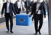 Police carrying out boxes of seized documents and files from Land and Housing Corp.'s headquarters in Jinju, South Gyeongsang on March 17 as part of its investigation on LH employees using insider information in purchasing properties. [YONHAP]