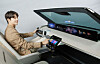 A model shows off a digitalized cockpit featuring LG Display's plastic organic light-emitting diode display. [LG DISPLAY]