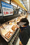 Chicken prices are displayed at E-mart's Seongsu branch in Seongdong District, eastern Seoul, on Thursday as competition to sell the most affordable chicken at large marts continues amid rising product prices. E-mart will sell its 'No. 9 Fried Chicken' for 5,980 won ($4.50) for one whole chicken for a week starting Thursday. [YONHAP]