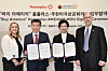 From left, Lisa Allen, director of the agricultural trade office at the U.S. Embassy in Seoul; James Kim, chairman and CEO of the American Chamber of Commerce in Korea (Amcham); Jo Ju-yeon, Homeplus CEO; and Mark Dries, agricultural minister-counselor at the U.S. Embassy in Seoul take a commemorative photo at the 'Buy America' Homeplus-Amcham MOU Signing Ceremony at Homeplus' headquarters in Gangseo District, western Seoul, on March 13. [HOMEPLUS]