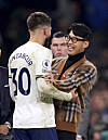 Tottenham Hotspur's Son Heung-min celebrates with Rodrigo Bentancur at the end of a Premier League match between Tottenham Hotspur and Leeds United at Tottenham Hotspur Stadium in London on Saturday. Bentancur scored two goals in the 4-3 victory, locking in the win after finding the back of the net twice in the final 10 minutes of the game. Son, who has been out following surgery on an orbital fracture, joined teammates to celebrate after the final whistle in his first public appearance since being injured on Nov. 1.  [AP/YONHAP]