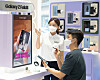 A customer tests the new Galaxy Z Fold 3 at the Samsung Digital Plaza Hongdae branch in western Seoul on Monday with the help of a staff member. Samsung Electronics will start accepting orders for its new Galaxy Z Fold 3 and Galaxy Z Flip 3 foldable smartphones for a week starting Tuesday. Sales begin on Aug. 27. [SAMSUNG ELECTRONICS]