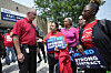 United Auto Workers President Shawn Fain, left, talks with autoworkers outside the General Motors Factory Zero plant in Hamtramck, Michigan on July 12. [AP/YONHAP]