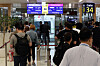 Passengers board a plane at the international flight boarding area of Gimpo International Airport in Gangseo District, western Seoul, on Wednesday, the same day the Gimpo-Haneda route resumed operation. Asiana Airlines Flight OZ1085 and Korean Air Lines Flight KE707 reopned for the first time in two years and three months after flights were suspended due to the Covid-19 pandemic. [YONHAP]