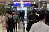 Passengers board a plane at the international flight boarding area of Gimpo International Airport in Gangseo District, western Seoul, on Wednesday, the same day the Gimpo-Haneda route resumed operation. Asiana Airlines Flight OZ1085 and Korean Air Lines Flight KE707 reopned for the first time in two years and three months after flights were suspended due to the Covid-19 pandemic. [YONHAP]
