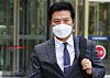 Gangseo District Chief Kim Tae-woo leaves the Suwon District Court on Aug. 12 after a hearing. [YONHAP]