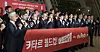 Asia-based members of the Korean national team along with coaching and administrative staff pose at Incheon International Airport on Sunday before departing for Qatar. [NEWS1]