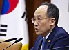 Finance Minister Choo Kyung-ho speaks about the government's plans to implement deregulatory measures for 18 projects led by private companies at a meeting held at the government complex in central Seoul. [YONHAP]