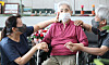 A daughter and son meet their mother in a nursing hospital in Daejeon on Monday when people were allowed to visit such facilities nationwide regardless of their vaccination status. [NEWS1]