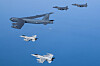 A U.S. B-52 Stratofortress long-range bomber flies at the front of a formation with South Korean KF-15 Slam Eagle strike fighters (above) and F-16K Fighting Falcon fighters (below) in the skies above the West Sea on Monday. [DEFENSE MINISTRY]