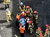 Fire rescue workers recover a deceased individual’s body after a fire erupted at Aricell, a lithium battery manufacturer located in Seosin-myeon, Hwaseong on Mondary morning. [NEWS1]
