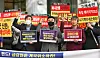 A group of people that invested in the German Heritage derivative-linked (DLS) securities products demand compensation in front of the Financial Supervisory Service office in western Seoul on Monday. [YONHAP]