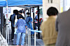 People line up to get tested for Covid-19 at a testing center in Yongsan District, central Seoul, on Tuesday. [YONHAP]