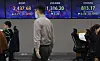 A screen in Hana Bank's trading room in central Seoul shows stock and foreign exchange markets open on Thursday. [YONHAP]