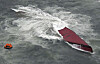 A Korean tanker is seen capsized off an island in southwestern Japan on Wednesday. [AP/YONHAP]