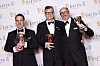 From left, James Friend, winner of the cinematography award, Malte Grunert and Edward Berger winners of the Best Film Not in the English Language award for ″All Quiet on the Western Front,″ pose for photographers at the 76th British Academy Film Awards, BAFTA's, in London, Sunday local time. [AP]