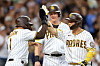 Trent Grisham, left, and Garrett Cooper, center, congratulate Kim Ha-seong of the San Diego Padres after he hit a grand slam during the second inning of a game against the Miami Marlins at Petco Park in San Diego on Monday. Kim went two-for-four in the game with two runs and four RBIs as the Padres beat the Marlins 6-2.  [AFP/YONHAP]