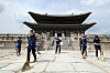 Workers from the Cultural Heritage Administration clean the courtyard of Gyeongbok Palace in central Seoul on Tuesday, as ancient palaces are set to reopen Wednesday, 55 days after closing amid a surge in Covid-19 cases. [NEWS1]
